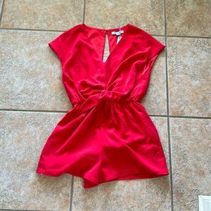 She and sky red romper. Never worn. Excellent condition.